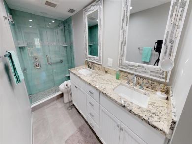 Just Steps to the Sandy Beach from this Two Bedroom Condo